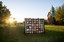 The official centennial quilt is displayed near Old Central, an historic building on the OSU campus in Stillwater.  - 